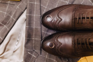 How do you shrink leather shoes