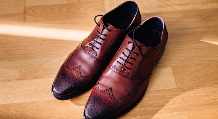 How do you shrink leather shoes